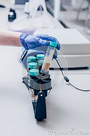 cropped image of biologist during work with tubes in modern Stock Photo