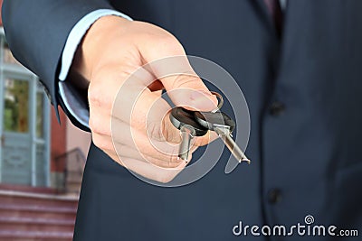 Cropped image of estate agent giving house keys Stock Photo