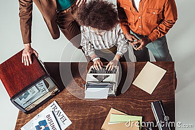 cropped image of multicultural retro styled journalists Stock Photo