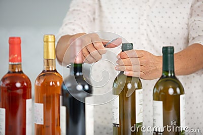 cropped image person opening bottles wine Stock Photo