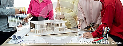 Professional architect team brainstorm about house color selection. Variegated. Stock Photo