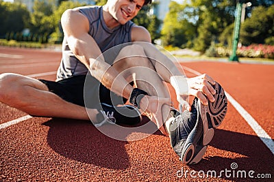 Cropped image of a runner suffering from leg cramp Stock Photo