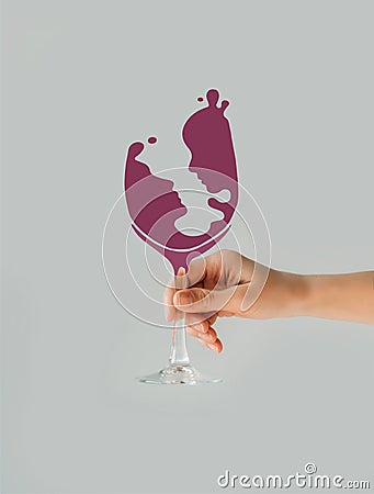 Cropped image of woman holding wine glass with couple silhouette Stock Photo