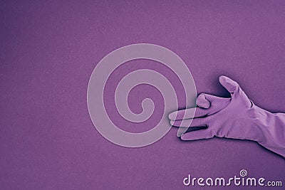 cropped image of woman showing sign with hand in rubber protective glove Stock Photo