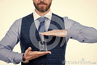 cropped man hold male perfume bottle, cologne Stock Photo