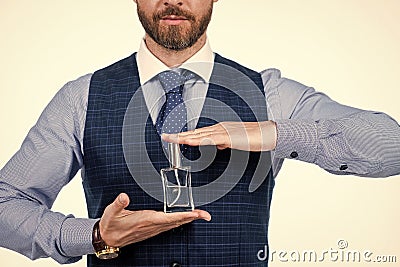 cropped man hold male perfume bottle, cologne Stock Photo