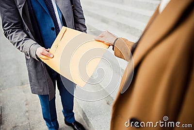 Two modern Caucasian business people standing outdoors Stock Photo