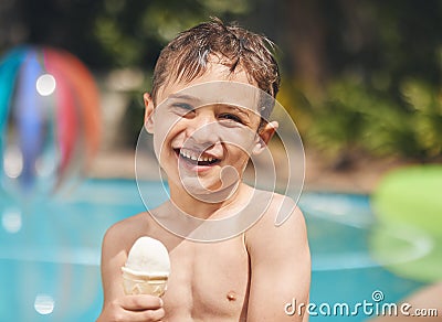 I love ice cream. Cropped portrait of an adorable little pool eating an ice cream while sitting outside by the pool. Stock Photo
