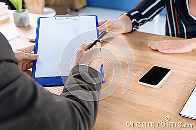 Business partners writing contract Stock Photo