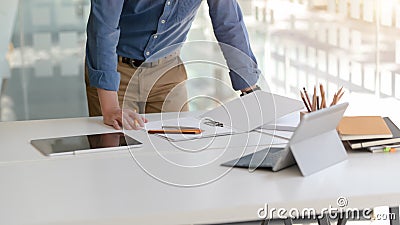 Cropped shot of businessman focusing on his work with digital tablets Stock Photo