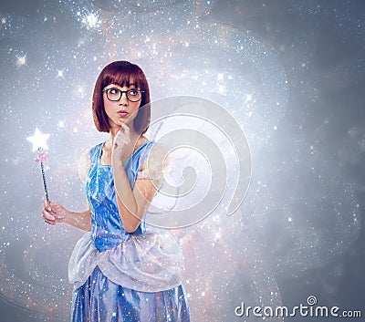 What wish should I grant next. A cropped shot of a fairy godmother in a blue gown. Stock Photo