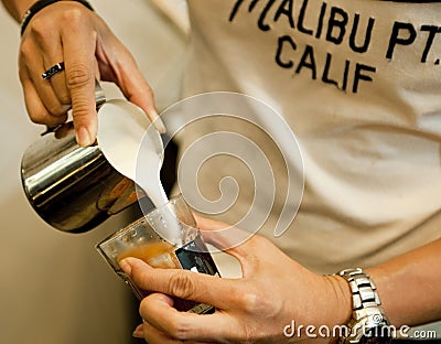 Cropped shot of hand of barista making. Focus on hands holding c Stock Photo