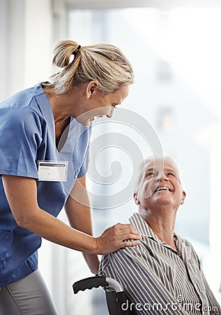Where to, mister. Cropped shot of a mature female nurse and her senior male wheelchair-bound patient in the hospital. Stock Photo