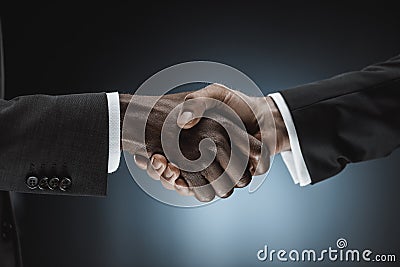 cropped shot of multicultural businessmen handshake Stock Photo