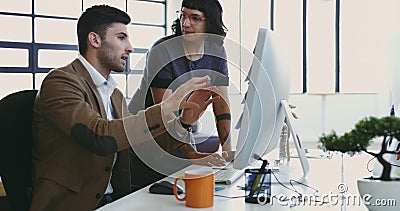 Im stuck on this one section.... Cropped shot of two young designers working together on a computer in their office. Stock Photo