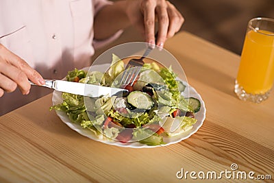 Woman eating fresh salad Stock Photo