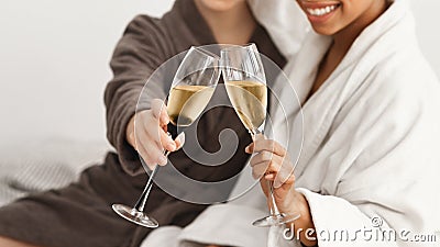 Cropped of spa ladies holding glasses with champagne Stock Photo