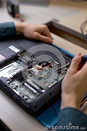 cropped technician or Engineer installing CPU microprocessor to motherboard socket Stock Photo
