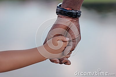 cropped view of african american grandfather holding hands Stock Photo