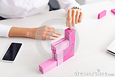 Cropped view of businesswoman stacking marketing Stock Photo