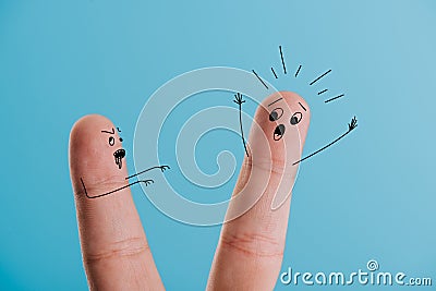 cropped view of frightened finger and zombie isolated on blue . Stock Photo