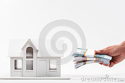 View of man holding russian money near carton house on white Stock Photo
