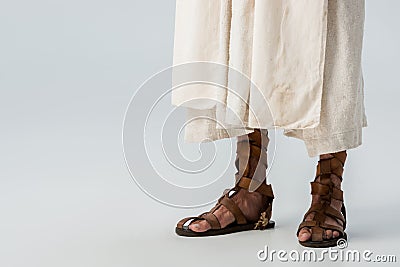 View of man standing in sandals on grey Stock Photo