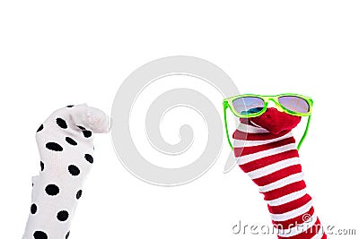 Cropped view of person with colorful sock puppets and sunglasses on hands Isolated On White. Stock Photo