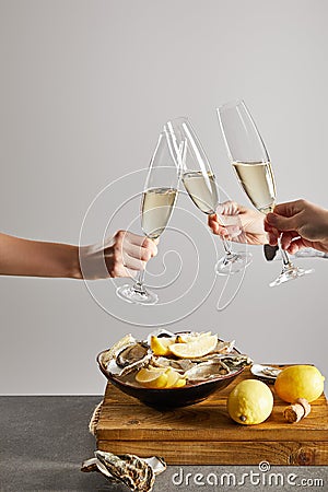 Cropped view of women clinking champagne Stock Photo