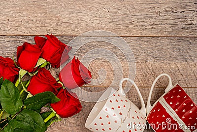 Cropped white and red mugs with hearts and roses Stock Photo