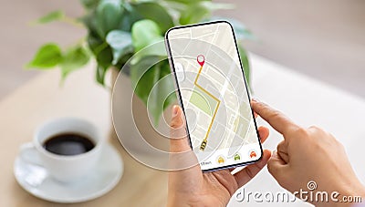 Cropped of woman using navigation mobile app on smartphone Stock Photo