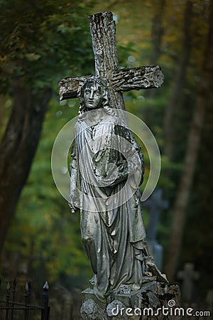 Cross and angel statue Stock Photo