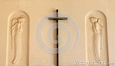 Cross and angels at churchyard in Italian Bruneck Stock Photo