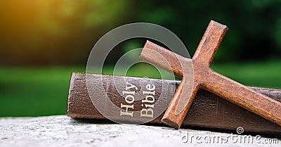 The cross and bible on stone. Stock Photo