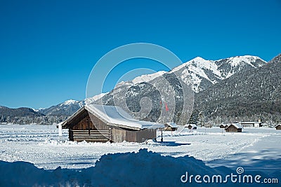 Cross-country route between wooden barns, near Garmisch-Partenkirchen, upper bavaria Stock Photo