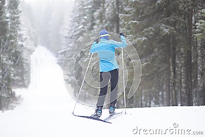 Cross country Skilling. A skier goes skiing on the ski track Editorial Stock Photo