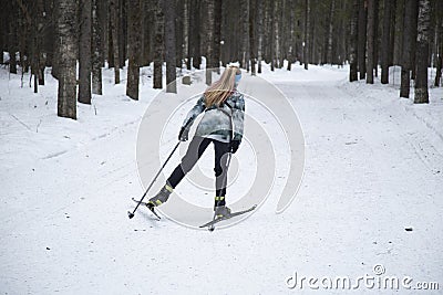 Cross country Skilling. A skier goes skiing on the ski track Editorial Stock Photo