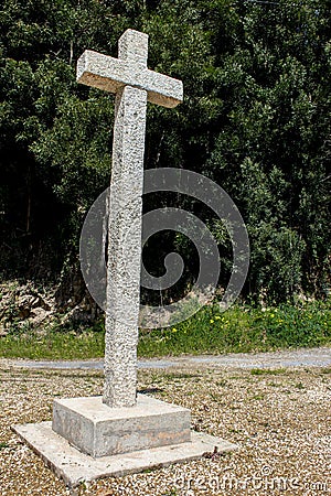 Cross in an European Village Stock Photo