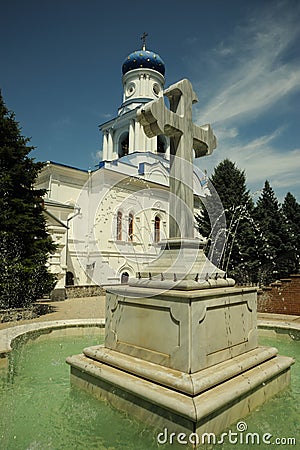 Cross - a fountain in orthodox laurels Stock Photo