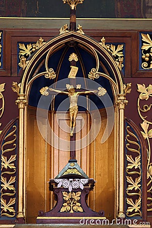 Cross on a high altar in the parish church of St. Martin in Dugo Selo, Croatia Editorial Stock Photo