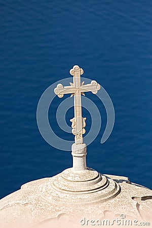 Cross high up over the sea Stock Photo