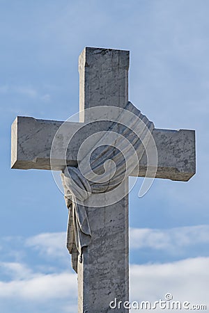 Cross with knotted cloth on Cemetery Editorial Stock Photo