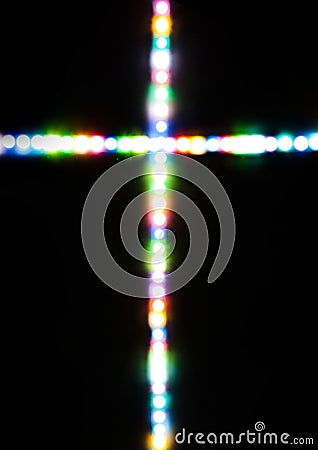 Cross made with several light colors Stock Photo