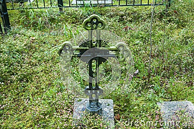 Cross at old beautiful semetery in Finland Stock Photo