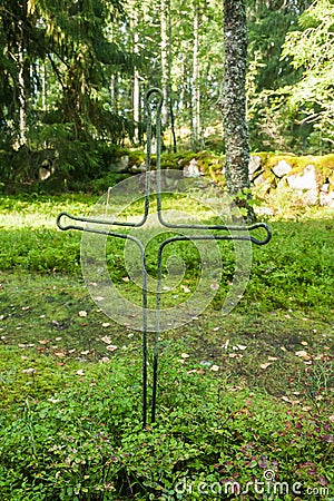 Cross at old beautiful semetery in Finland Stock Photo