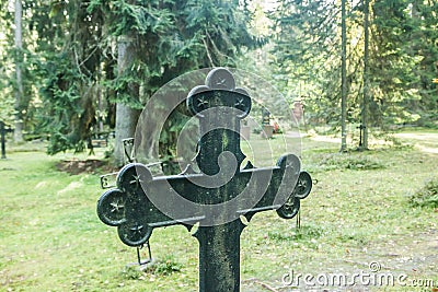 Cross at old beautiful semetery in Finland Stock Photo