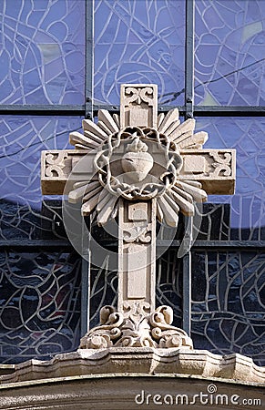 Cross on portal of Parish Church of the Holy Blood in Graz Stock Photo