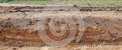 Cross-section of the pavement with layers of clay sand and asphalt. Panoramic collage from several outdoor photos Stock Photo