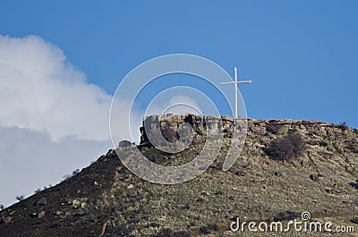 Cross Standing High on the Mountain Stock Photo