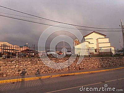 cross track near church in sunset Editorial Stock Photo